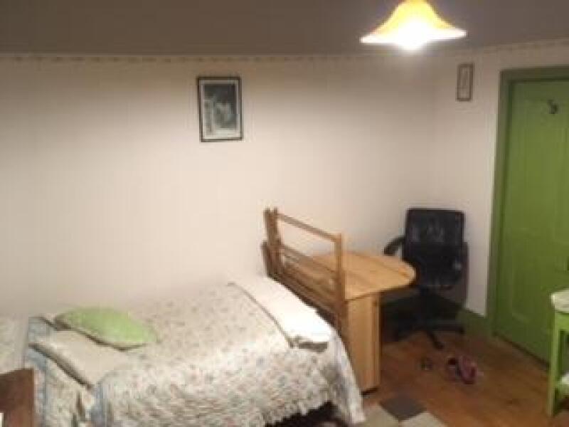 bedroom with bed, table/desk and chair