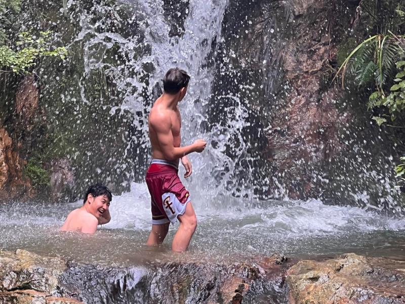 Boys at a waterfall by our holiday home!